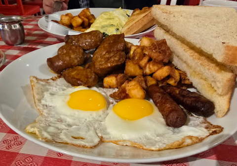Full breakfast plate with eggs, sausage and toast
